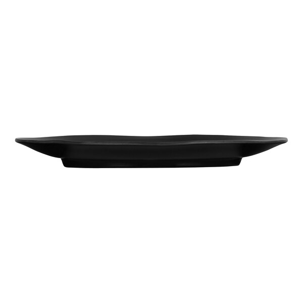 A black Cal-Mil oval melamine platter on a table.