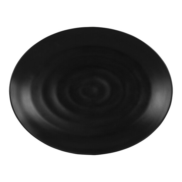 A black oval melamine platter with a ripples design.