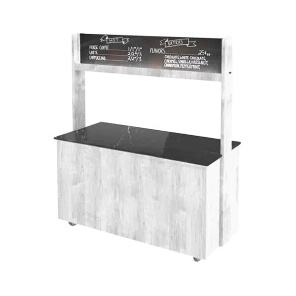 A white and black Astra coffee cart counter with a chalk board sign.