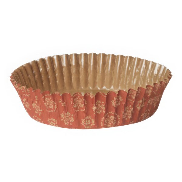 A red and orange Welcome Home Brands damask patterned baking cup.