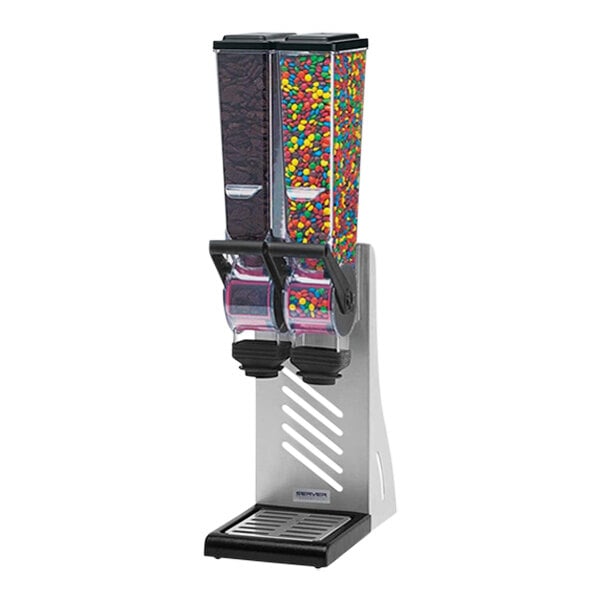 A Server SlimLine countertop double canister dry food and candy dispenser with a couple of dispensers filled with colorful candy.