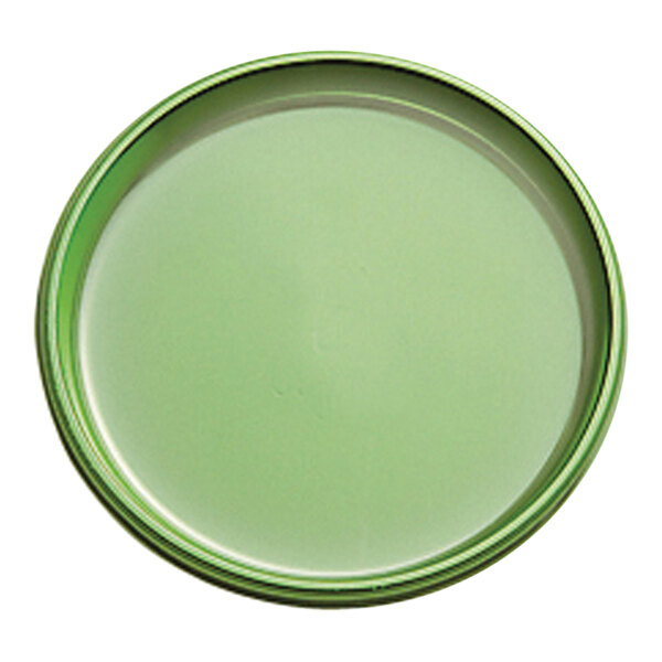 A green circular tray with a white background.