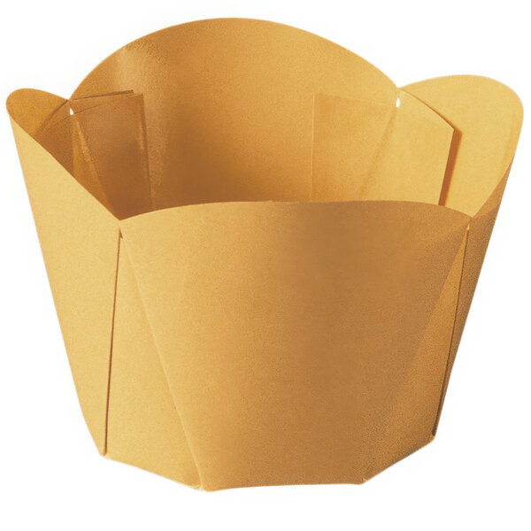 A yellow scalloped brown paper baking cup with a fold out top.