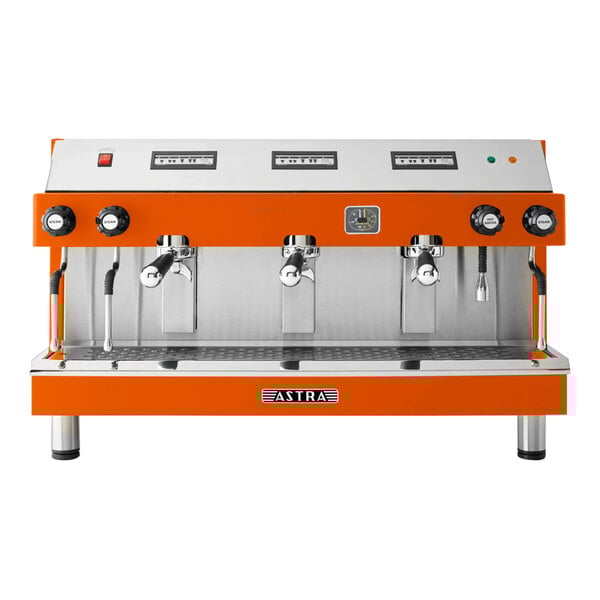 An orange and silver Astra Mega III automatic espresso machine with three spouts.