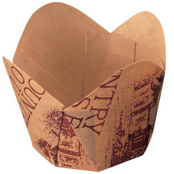 A brown paper "Country Home" baking cup with a scalloped design.