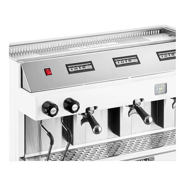 An automatic white espresso machine with multiple group heads and control knobs.