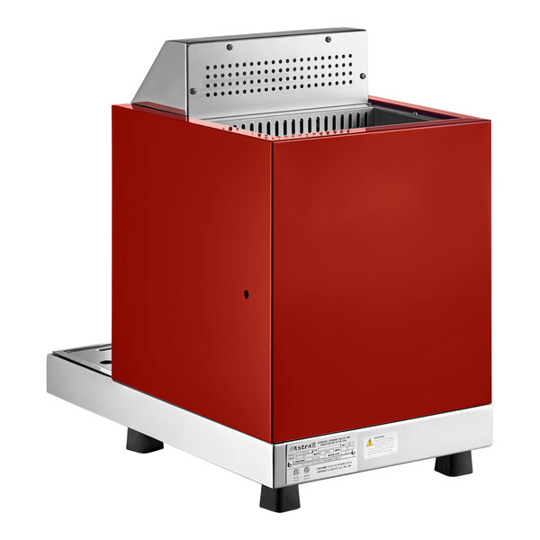 A red automatic milk and beverage steamer with two wands and a stainless steel base.