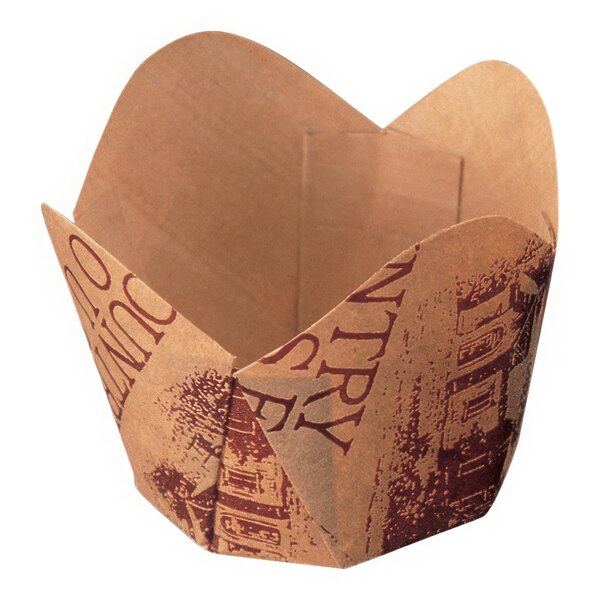 A brown paper Welcome Home Brands "Country Home" scalloped baking cup.