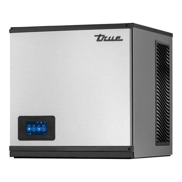 A silver and black True Ice air cooled ice machine with a blue digital display.