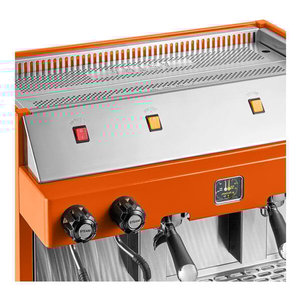 An orange semi-automatic espresso machine with control knobs, switches, and a pressure gauge.