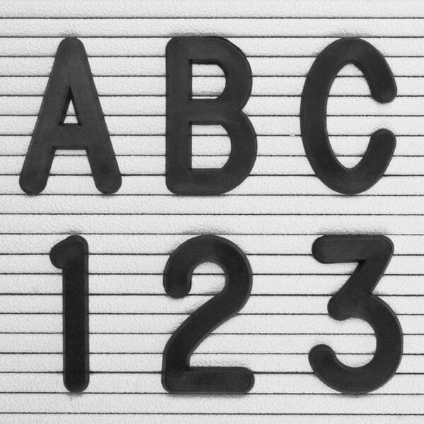 A close-up of a black United Visual Products Helvetica character "1" on a white background.