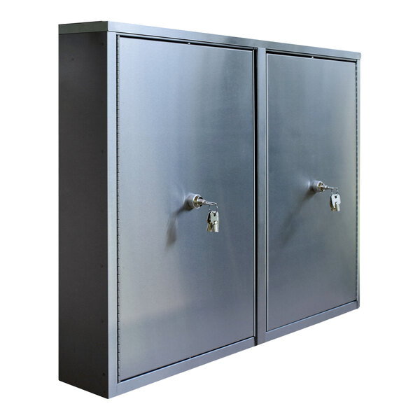 A stainless steel wall-mount twin narcotics cabinet with 2 shelves and 4 key locks.