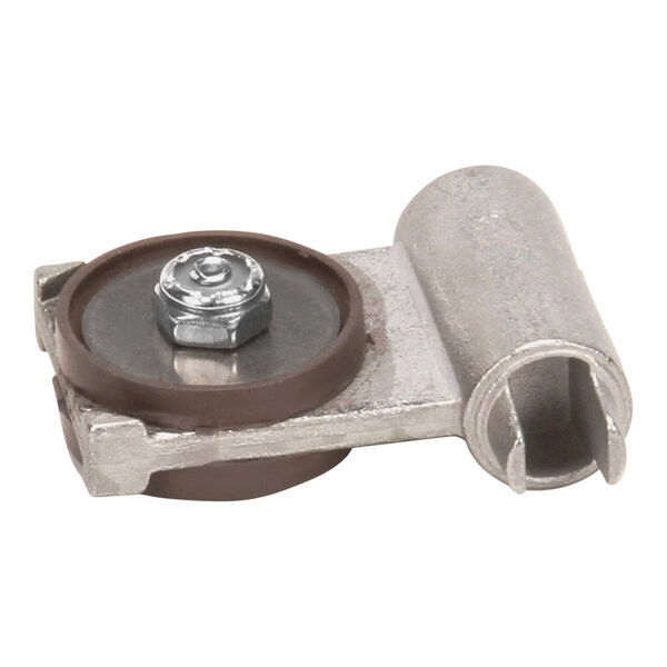 A metal and brown wheel with a nut on a metal object.