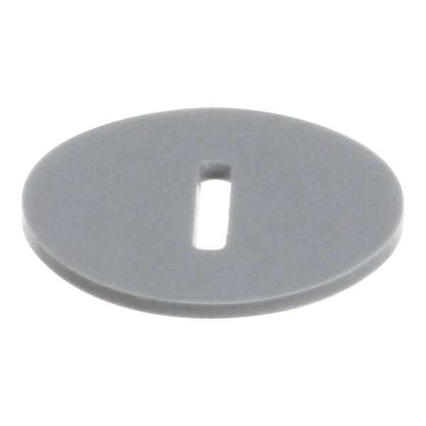 A gray plastic circle with a hole in the middle.