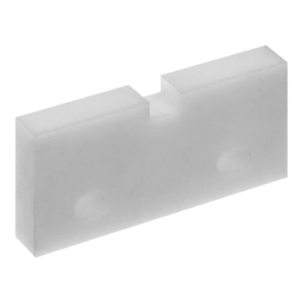 A white rectangular plastic piece with two holes.