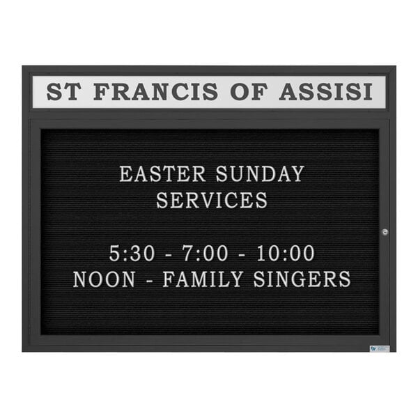 A black United Visual Products enclosed outdoor church letterboard with white text that reads "St. Francis of Assisi Easter Sunday Services" on a white background.