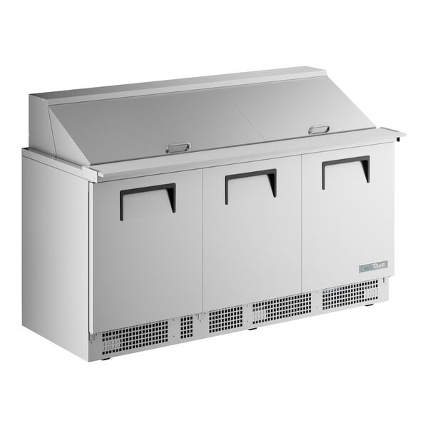 A True stainless steel mega top sandwich prep table with three doors.