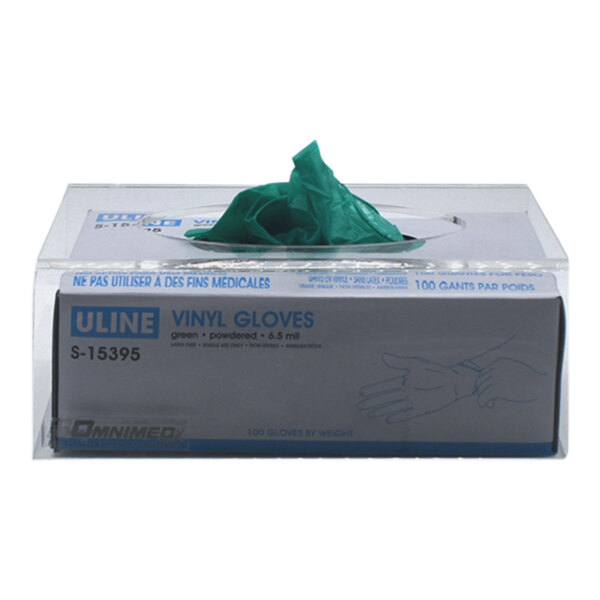 A box of disposable gloves on a wall mount.