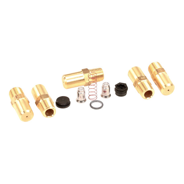 A group of gold and black brass fittings and springs for a Frymaster gas valve.