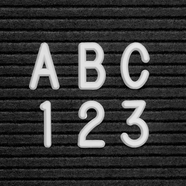 A pack of white United Visual Products Helvetica characters.
