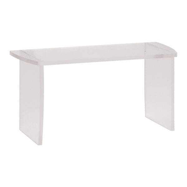 A clear acrylic rectangular table riser on a white table.