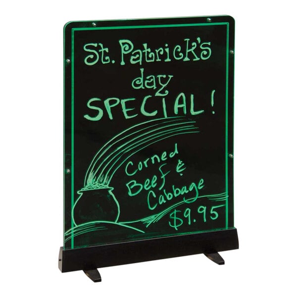 A United Visual Products illuminated menu board with green writing on it.