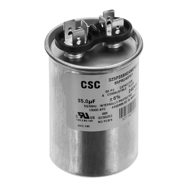 A round silver Follett capacitor with black rubber rings and the words "CSC" on it.