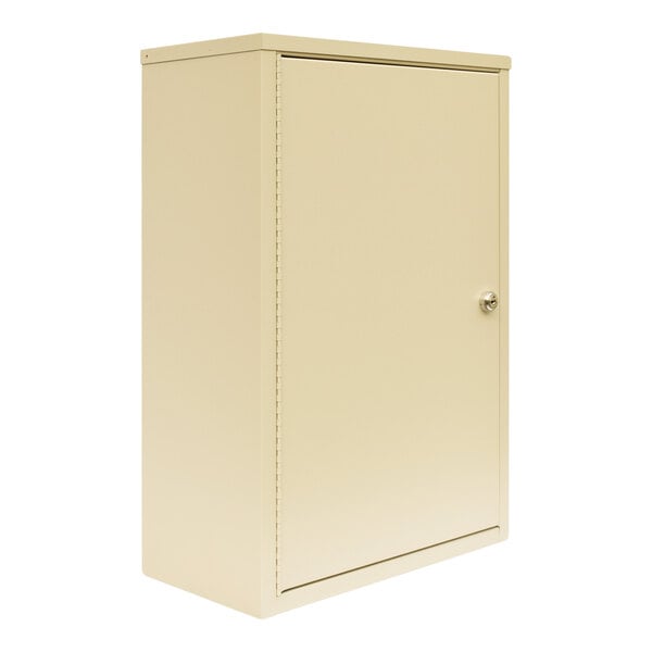 A beige metal Omnimed wall-mount narcotics cabinet with a door.