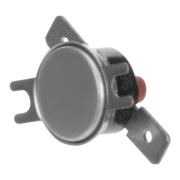 A round metal thermostat with a red button.