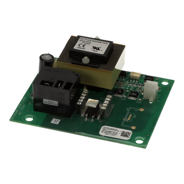 A green circuit board with black and white electronic components.