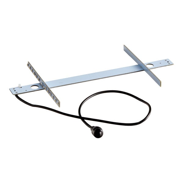 A metal bracket assembly with two perpendicular crossbars and an attached black cord ending in a small round sensor or component.