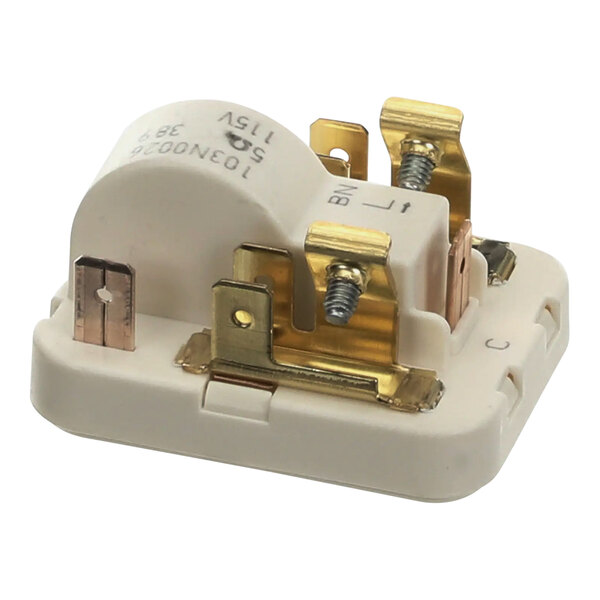 A white electrical starting device with gold and silver metal parts.