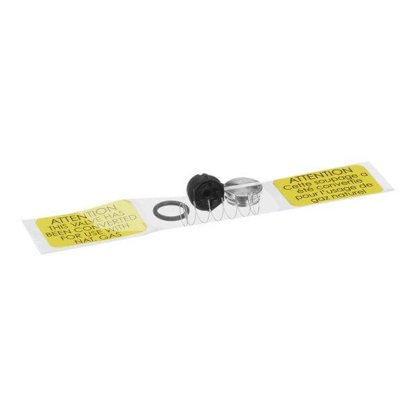 A black rubber seal with a yellow sticker and metal spring on a white background.