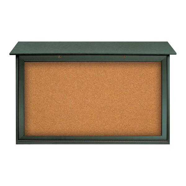 A corkboard with a green frame on one side and a black surface on the other.