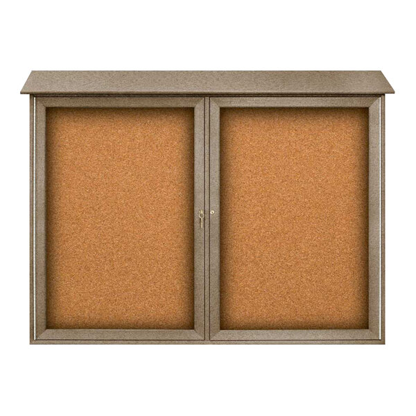 A corkboard message center with double doors and a weathered wood frame.