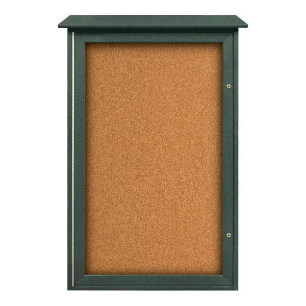 A cork board with a green frame.