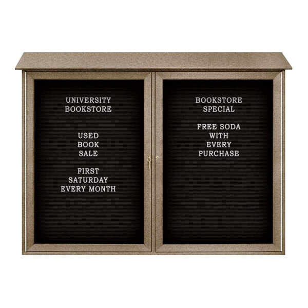 A United Visual Products double door bulletin board with black felt and white text on a black sign.