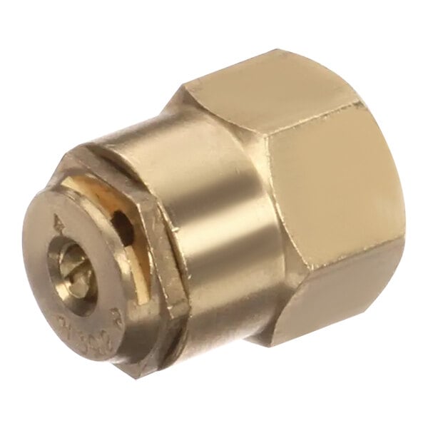 A gold metal nut with a hole on a brass threaded connector.