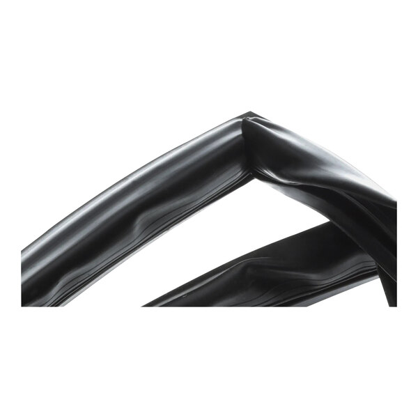 A close-up of a black rubber door gasket with a curved end.