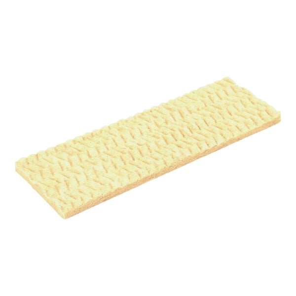 A rectangular yellow foam insulation piece.