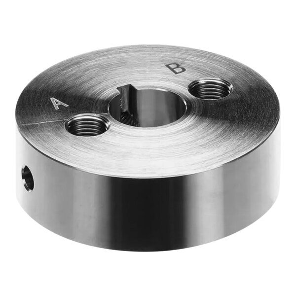 A round metal drive cam with keyway holes.