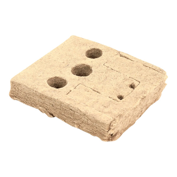 A white square insulation block with holes in it.