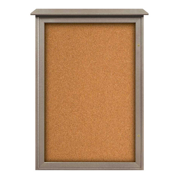 A cork board with a weathered wood frame and a glass door.