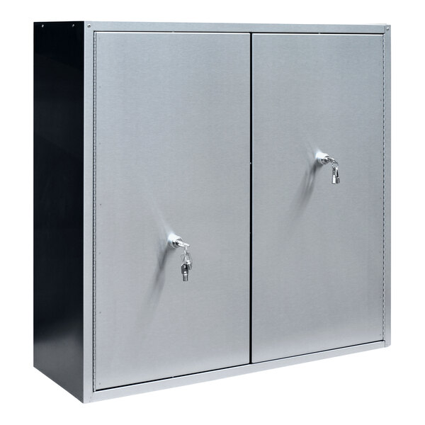 A close-up of a stainless steel Omnimed narcotics cabinet with two doors and two key locks.