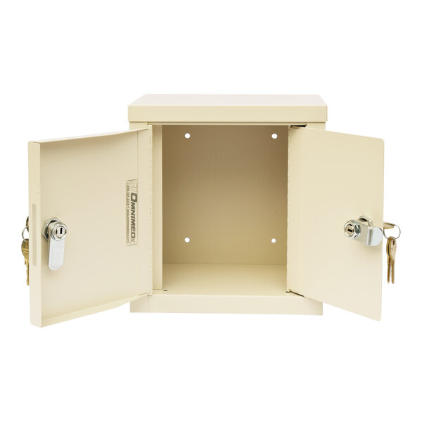A beige steel Omnimed mini wall-mount narcotics cabinet with open doors and keys.