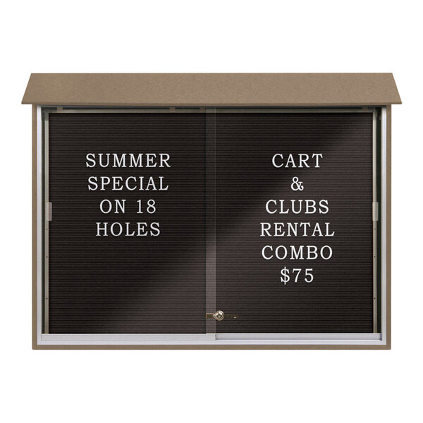 A black United Visual Products sliding glass door message center with white text on a letterboard.