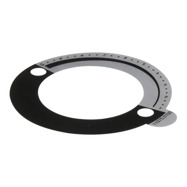 A circular black and white decal with holes and text on it.