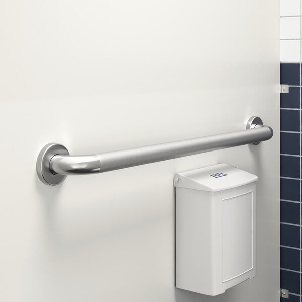 A Lavex restroom grab bar on a wall next to a toilet.
