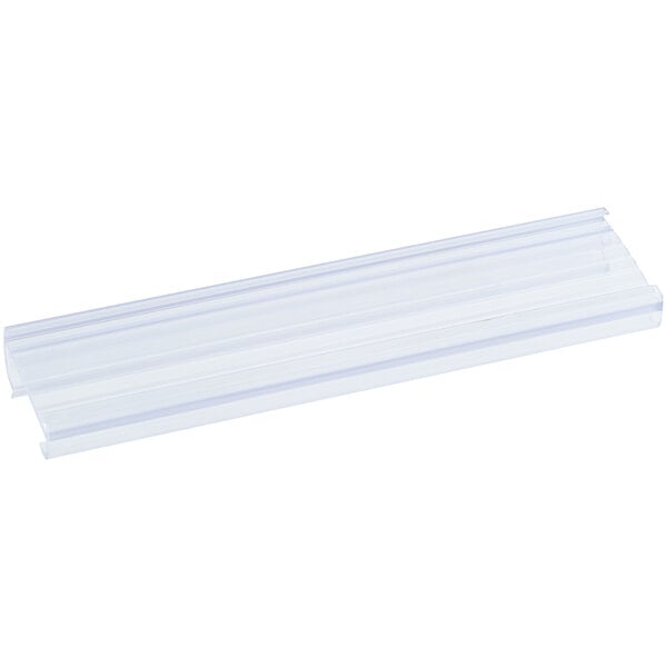 A clear plastic tube with a white plastic strip inside.