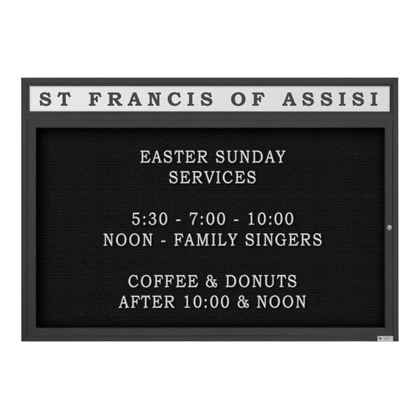 A black United Visual Products outdoor letterboard for St. Francis of Assisi with white text on a white background.